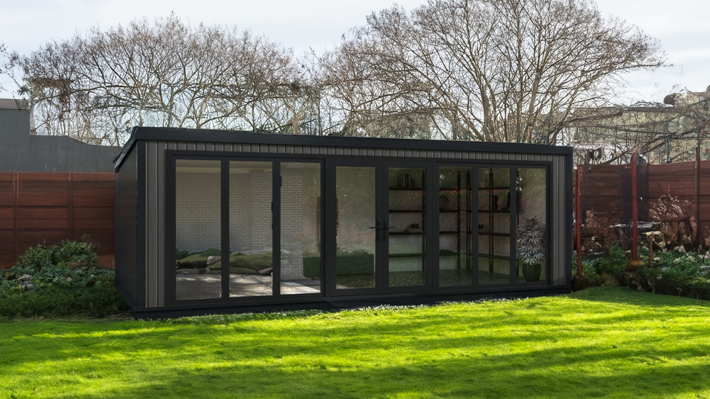 Garden room with grey wood effect cladding and anthracite bifold full width doors located in a grassed garden
